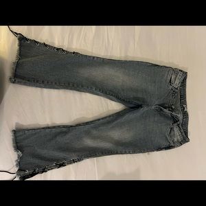 Blue grey flare jeans with tie knots on side